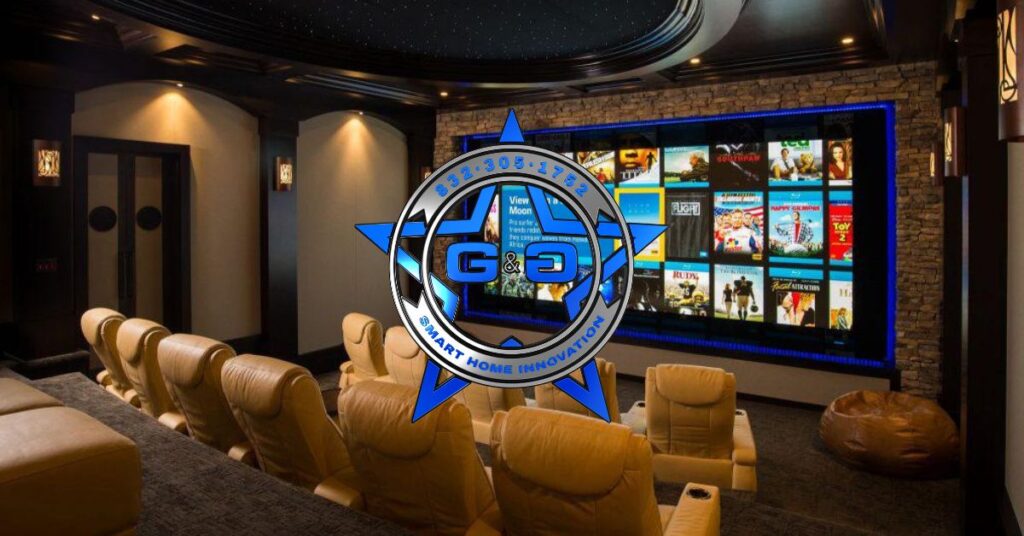 image of a theater room with large screen and theater style chairs what the company sets up.